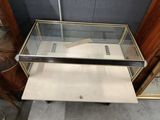 a glass table with a mirror on top of it