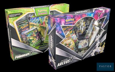 two boxes of pokemon cards are shown on a black background