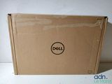 a dell laptop in the box on the table