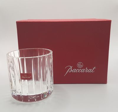 a close up of a glass with a box on a table