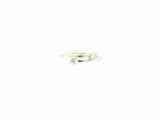 a white ring with three diamonds on it