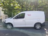 a white van that is parked in a parking lot