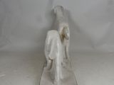 a small statue of a dog and a cat on a table