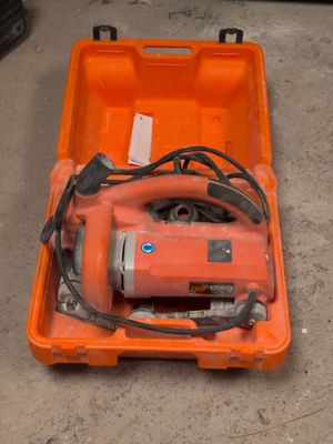 an orange tool box with a corded sander in it