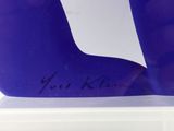 purple glass sculpture of a person ' s foot with a signature on it