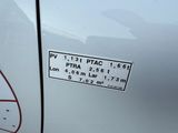 a sticker on the side of a white car