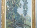 une peinture à l'huile représentant une rivière et des arbres, dans un cadre doré