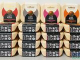 a stack of coffee cartons stacked on top of each other