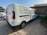 a white van that is parked in a parking lot