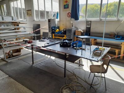 a table with a lot of tools on it in a room