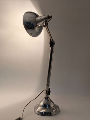 a lamp that is sitting on a table in the room