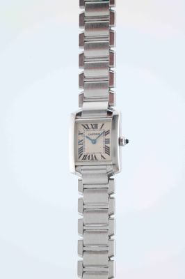 a close up of a wrist watch with roman numerals on it