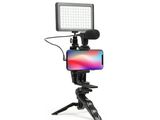 a close up of a camera with a cell phone on a tripod