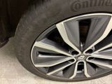 a close up of a tire on a car ' s rim