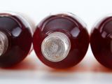 three bottles of wine sitting next to each other on a table