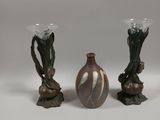 three vases that are sitting on a table
