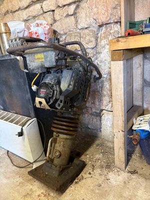 an image of an old engine and other items in a garage