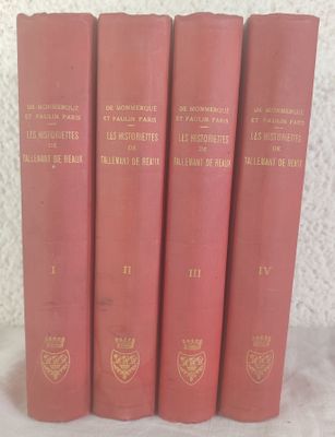 four red books are lined up on a white surface