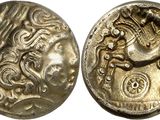 a silver coin with an image of a horse on it