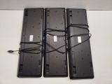 three laptops that are sitting on a table