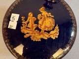 a decorative plate with a picture of a man riding a horse