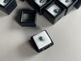 a lot of black and white boxes with green gems on them