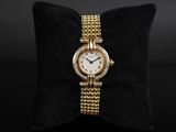 a lady ' s 18k yellow gold and diamond set wrist watch
