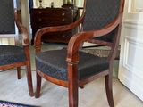two chairs in a room with a rug on the floor