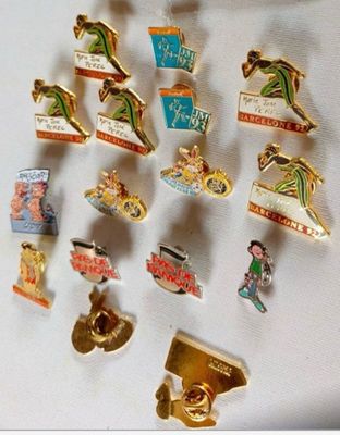 a lot of pins that are on a white surface