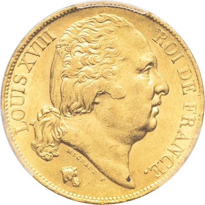 gros plan d'une pièce d'or sur fond blanc