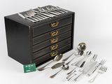 a black box with silverware on top of it