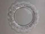 a clear glass plate with a flower design on it