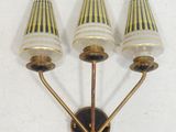 three light wall sconce with three lamps on each of them