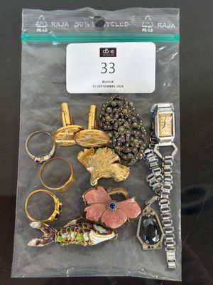 a bag of assorted jewelry sitting on a table