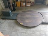 an image of a garage with a table in the middle of the floor