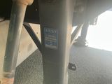 a close up of a parking meter on the ground