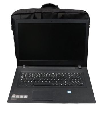 an open laptop computer sitting on top of a black bag