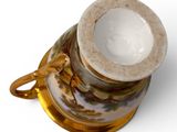 an image of a cup and saucer on a white surface