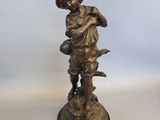 paire de figurines anciennes en bronze représentant un garçon et un chien