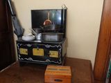 a small stove with pots and pans on top of it