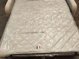 an image of a couch with a mattress attached to it in a room
