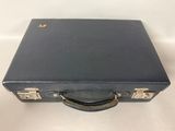 a black suitcase sitting on top of a white table