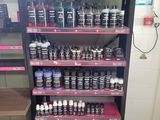 a close up of a store shelf filled with lots of different types of paint
