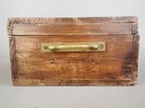 a wooden box with a brass handle on a table
