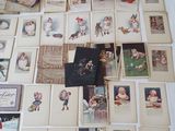 a lot of old christmas cards on the table