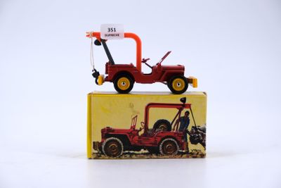 a red toy truck sitting on top of a yellow box