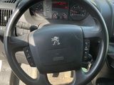 dashboard of a car with a steering wheel and dashboard controls