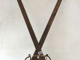 a pair of scissors on a stand on the floor