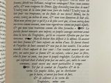 an open book with a picture of a bird on it