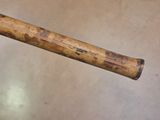 a baseball bat that has a wooden handle on it